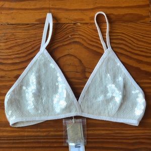 Cream with sequins bra. New with tags. Measures a 32-34A. Dry clean only